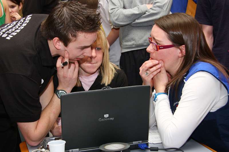 ASRA_Erg08-082.jpg - Colin, Judith and Morag concentrate on working out the Team Event handicap